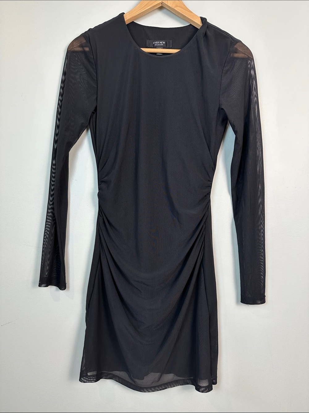 30. EVER NEW black mesh, long sleeved, mini dress.